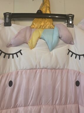 Sparkle the Unicorn" children's sleeping bag in pink and white.